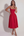 Vestido midi con corsé y falda fluida