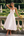 Vestido midi con corsé y falda amplia